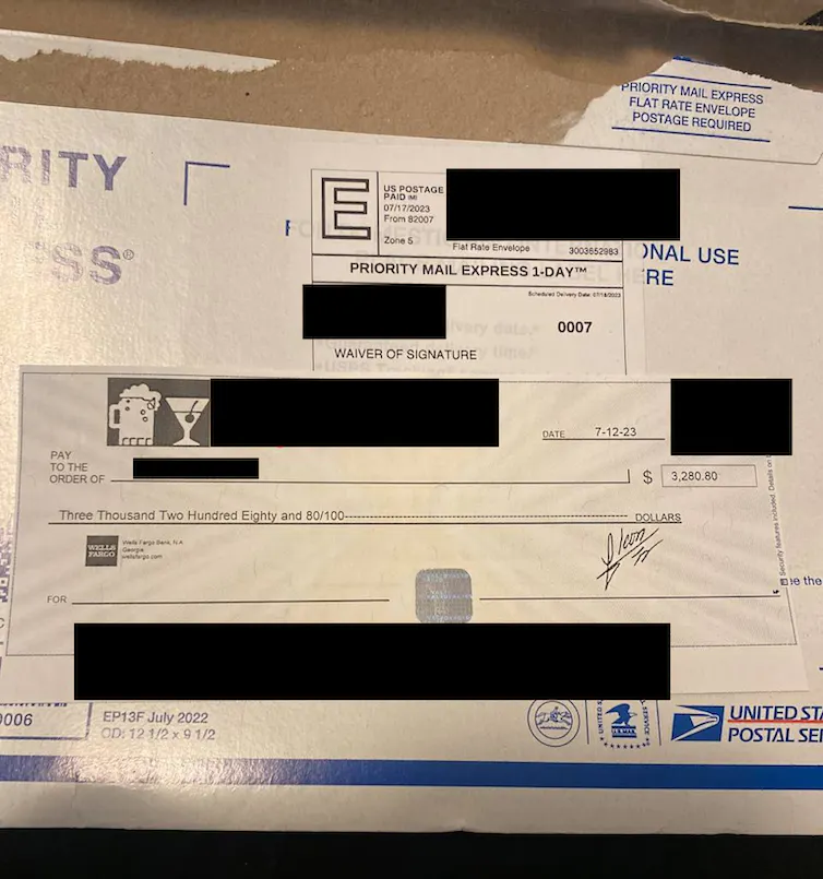 A forged or stolen check alongside the envelope used to mail it to the person who bought it on the dark web. Screen capture by David Maimon, CC BY-NC-ND